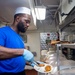 USS Ronald Reagan (CVN 76) Sailors prepare and serve food