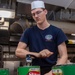 USS Ronald Reagan (CVN 76) Sailors prepare and serve food
