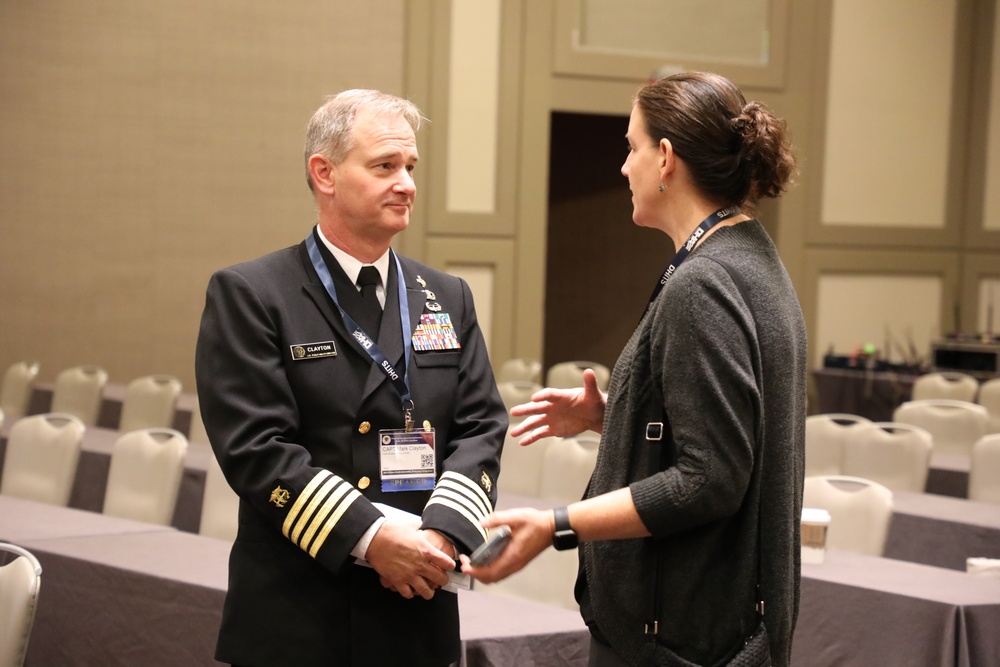 CAPT Mark Clayton and Angie Hester Talk after a session at DHITS 2023