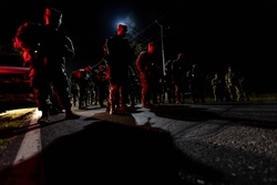 Expert Soldier Badge candidates line up for the start of the 12 mile ruck march [Image 1 of 6]