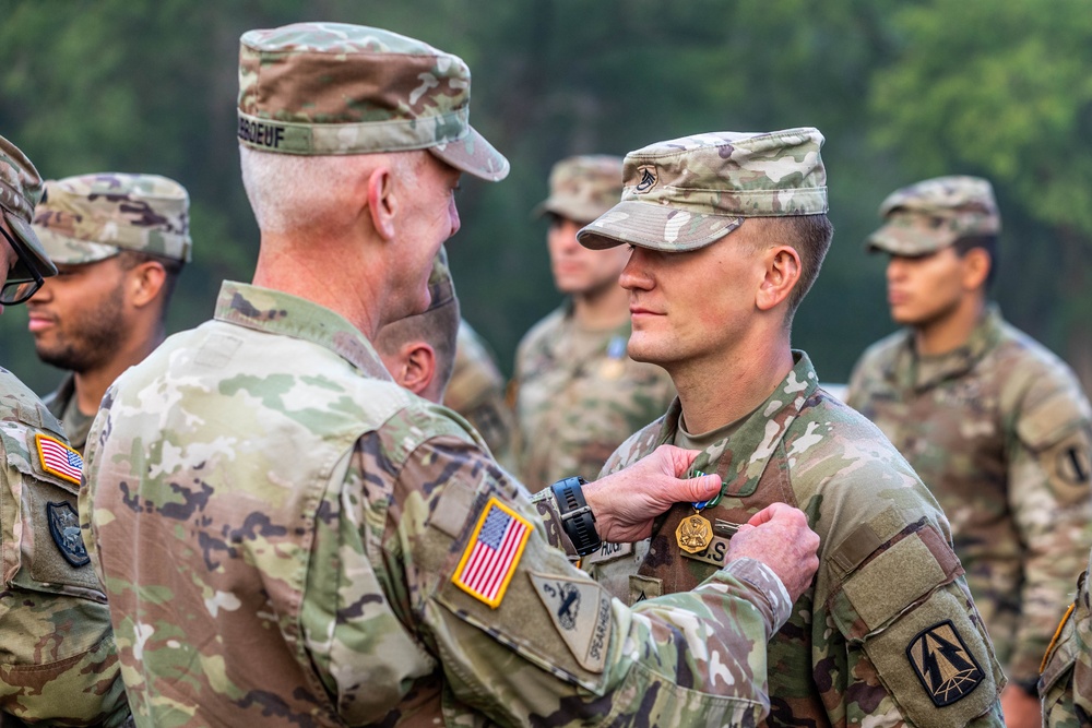 Maj. Gen. Gene LeBoeuf awards Staff Sgt. Preston Hough the Expert Soldier Badge