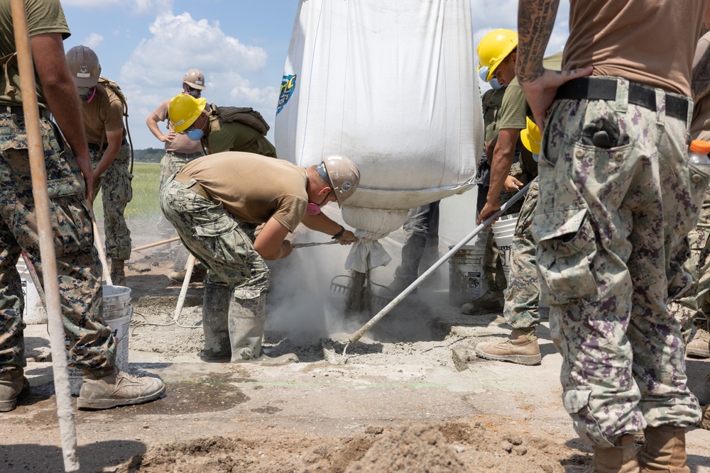 Marine Wing Support Squadron (MWSS) 272 works alongside Naval Mobile Construction Battalion 11 to conduct airfield damage repair