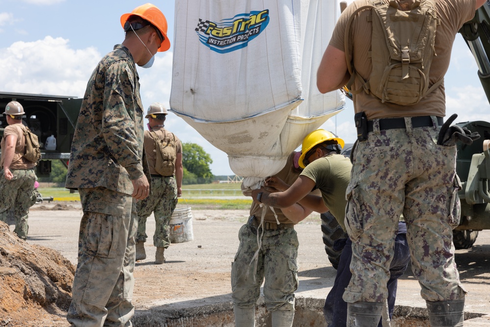 Marine Wing Support Squadron (MWSS) 272 works alongside Naval Mobile Construction Battalion 11 to conduct airfield damage repair