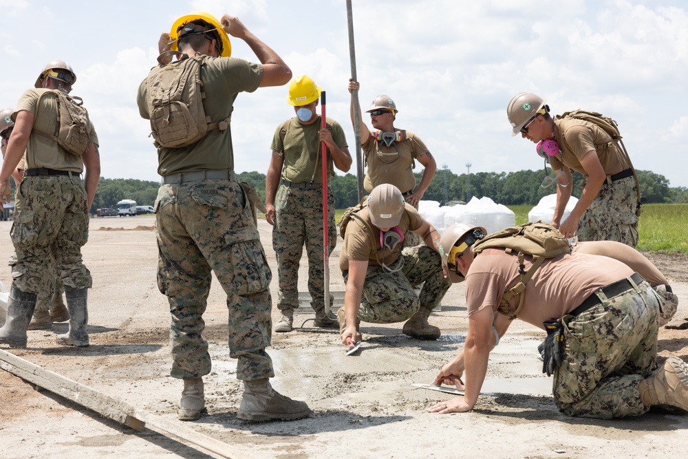 Marine Wing Support Squadron (MWSS) 272 works alongside Naval Mobile Construction Battalion 11 to conduct airfield damage repair