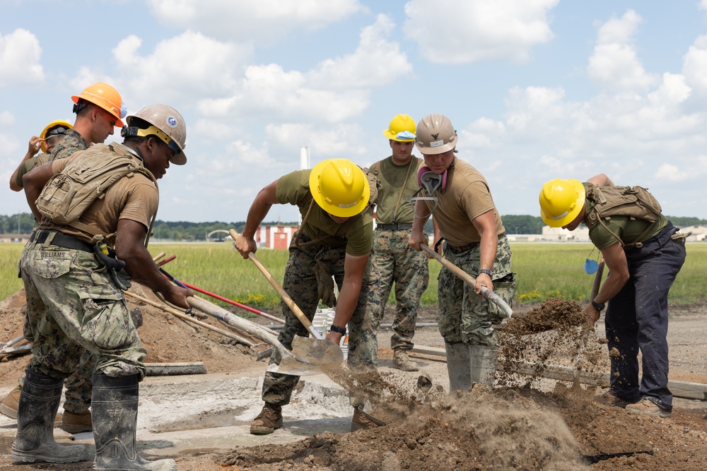 Marine Wing Support Squadron (MWSS) 272 works alongside Naval Mobile Construction Battalion 11 to conduct airfield damage repair