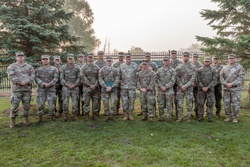 Maj. Gen. Gene LeBoeuf stands with the 16 Expert Soldier Badge recipients and the two board presidents [Image 1 of 2]