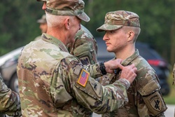 Maj. Gen. Gene LeBoeuf awards Private 1st Class Tyson Clark the Expert Soldier Badge [Image 2 of 2]