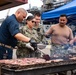 Abraham Lincoln Sailors participate in a fundraising BBQ event