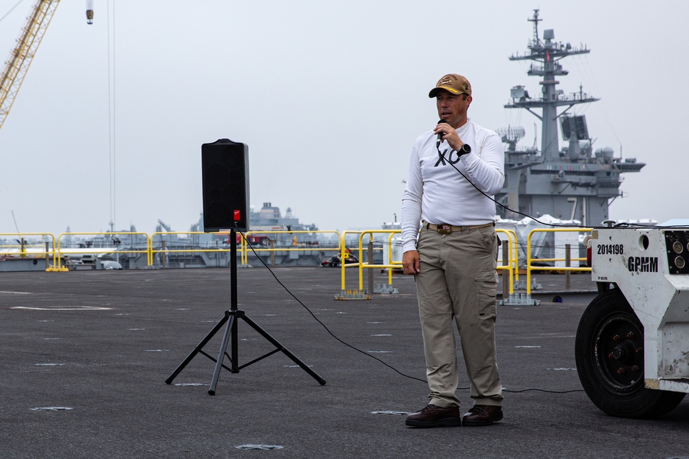 Capt. Baker gives remarks during farewell ceremony on Abraham Lincoln