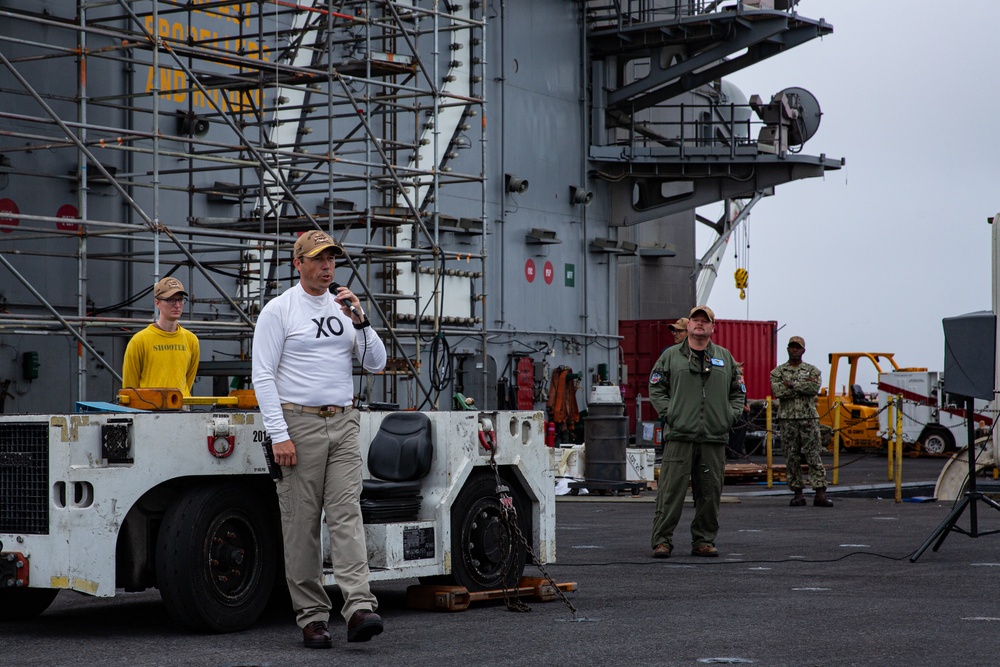 Capt. Baker gives remarks during farewell ceremony on Abraham Lincoln