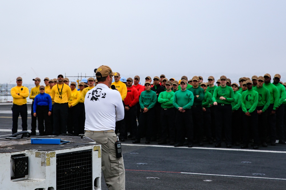 Capt. Baker gives remarks during farewell ceremony on Abraham Lincoln