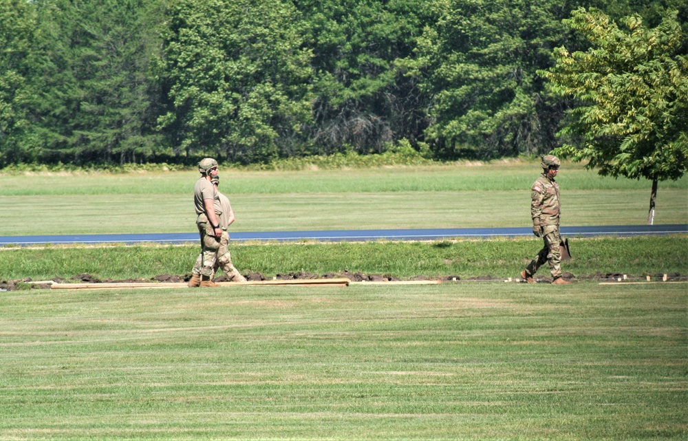 Army Reserve engineer unit training in CSTX 86-23-02 helps complete sidewalk project at Fort McCoy