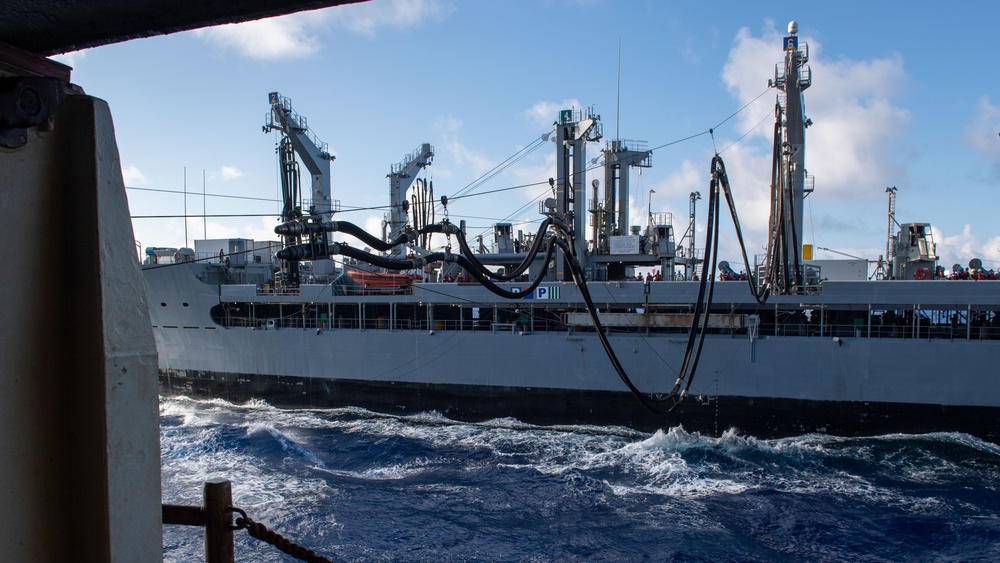 USS Ronald Reagan (CVN 76) conducts replenishment-at-sea with USNS Yukon (T-AO 202) and USNS Carl Brashear (T-AKE 7)