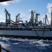 USS Ronald Reagan (CVN 76) conducts replenishment-at-sea with USNS Yukon (T-AO 202) and USNS Carl Brashear (T-AKE 7)