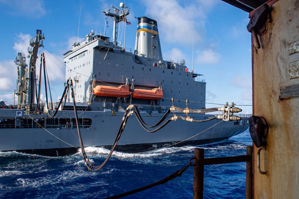 USS Ronald Reagan (CVN 76) conducts replenishment-at-sea with USNS Yukon (T-AO 202) and USNS Carl Brashear (T-AKE 7)