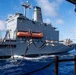 USS Ronald Reagan (CVN 76) conducts replenishment-at-sea with USNS Yukon (T-AO 202) and USNS Carl Brashear (T-AKE 7)