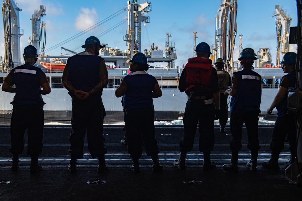 USS Ronald Reagan (CVN 76) conducts replenishment-at-sea with USNS Yukon (T-AO 202) and USNS Carl Brashear (T-AKE 7)