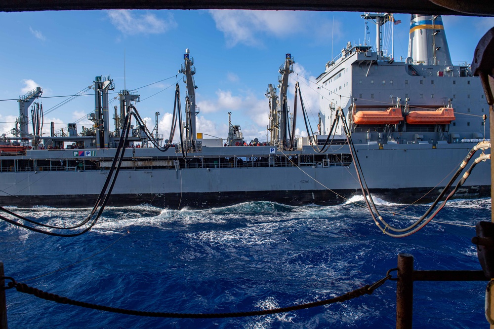 USS Ronald Reagan (CVN 76) conducts replenishment-at-sea with USNS Yukon (T-AO 202) and USNS Carl Brashear (T-AKE 7)