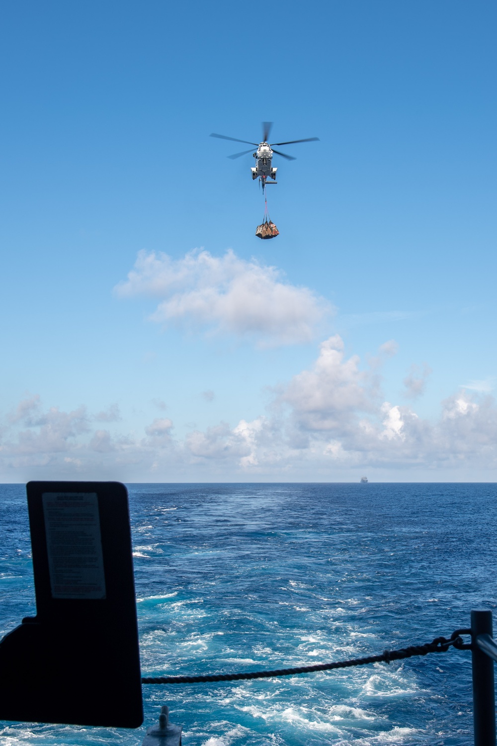 USS Ronald Reagan (CVN 76) conducts replenishment-at-sea with USNS Yukon (T-AO 202) and USNS Carl Brashear (T-AKE 7)