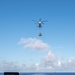 USS Ronald Reagan (CVN 76) conducts replenishment-at-sea with USNS Yukon (T-AO 202) and USNS Carl Brashear (T-AKE 7)