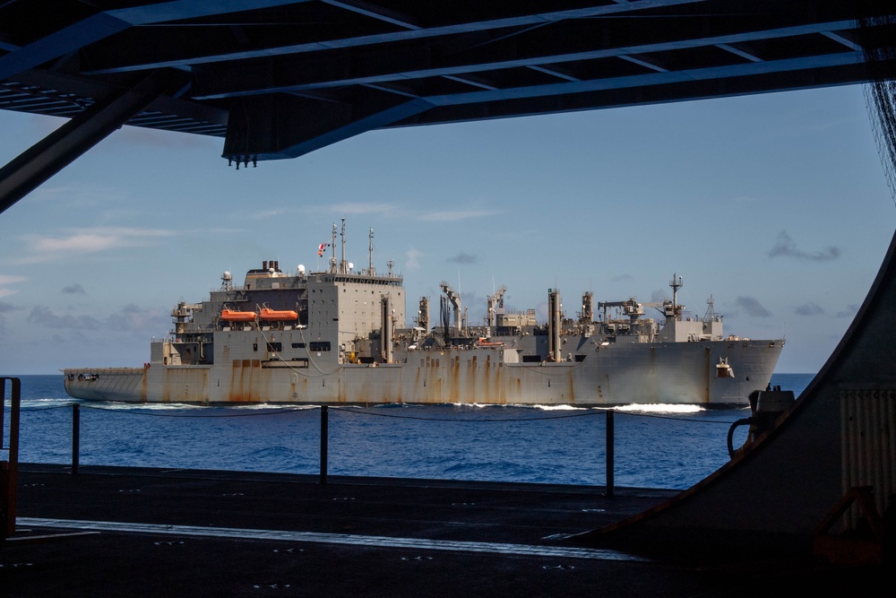 USS Ronald Reagan (CVN 76) conducts replenishment-at-sea with USNS Yukon (T-AO 202) and USNS Carl Brashear (T-AKE 7)