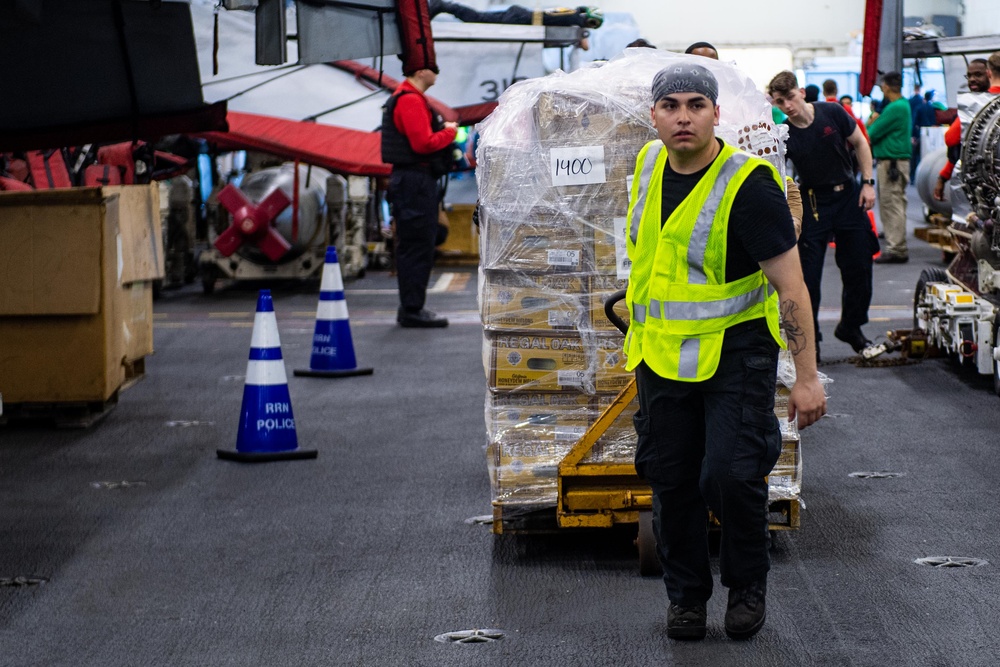 USS Ronald Reagan (CVN 76) conducts replenishment-at-sea with USNS Yukon (T-AO 202) and USNS Carl Brashear (T-AKE 7)