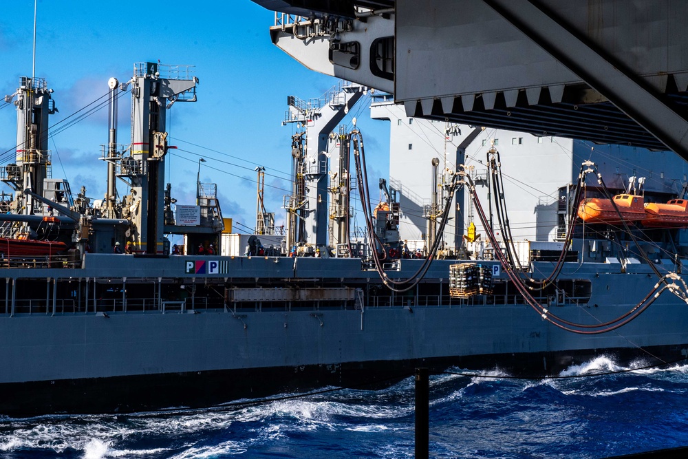 USS Ronald Reagan (CVN 76) conducts replenishment-at-sea with USNS Yukon (T-AO 202) and USNS Carl Brashear (T-AKE 7)