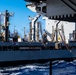 USS Ronald Reagan (CVN 76) conducts replenishment-at-sea with USNS Yukon (T-AO 202) and USNS Carl Brashear (T-AKE 7)