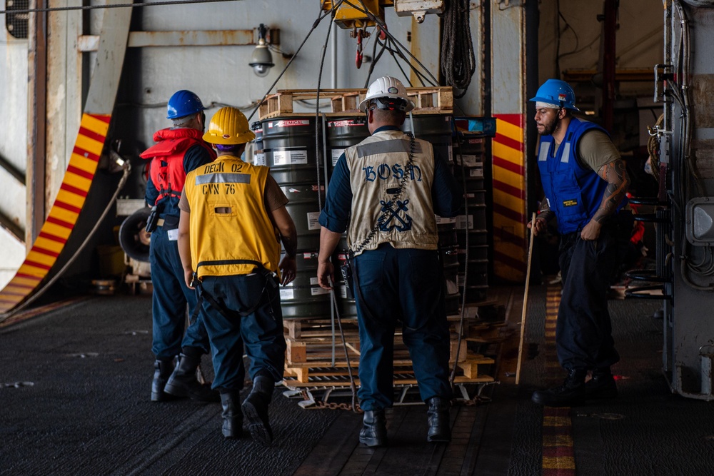 USS Ronald Reagan (CVN 76) conducts replenishment-at-sea with USNS Yukon (T-AO 202) and USNS Carl Brashear (T-AKE 7)