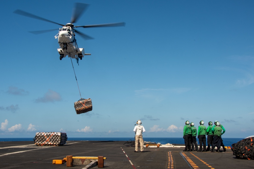 USS Ronald Reagan (CVN 76) conducts replenishment-at-sea with USNS Yukon (T-AO 202) and USNS Carl Brashear (T-AKE 7)