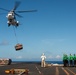 USS Ronald Reagan (CVN 76) conducts replenishment-at-sea with USNS Yukon (T-AO 202) and USNS Carl Brashear (T-AKE 7)