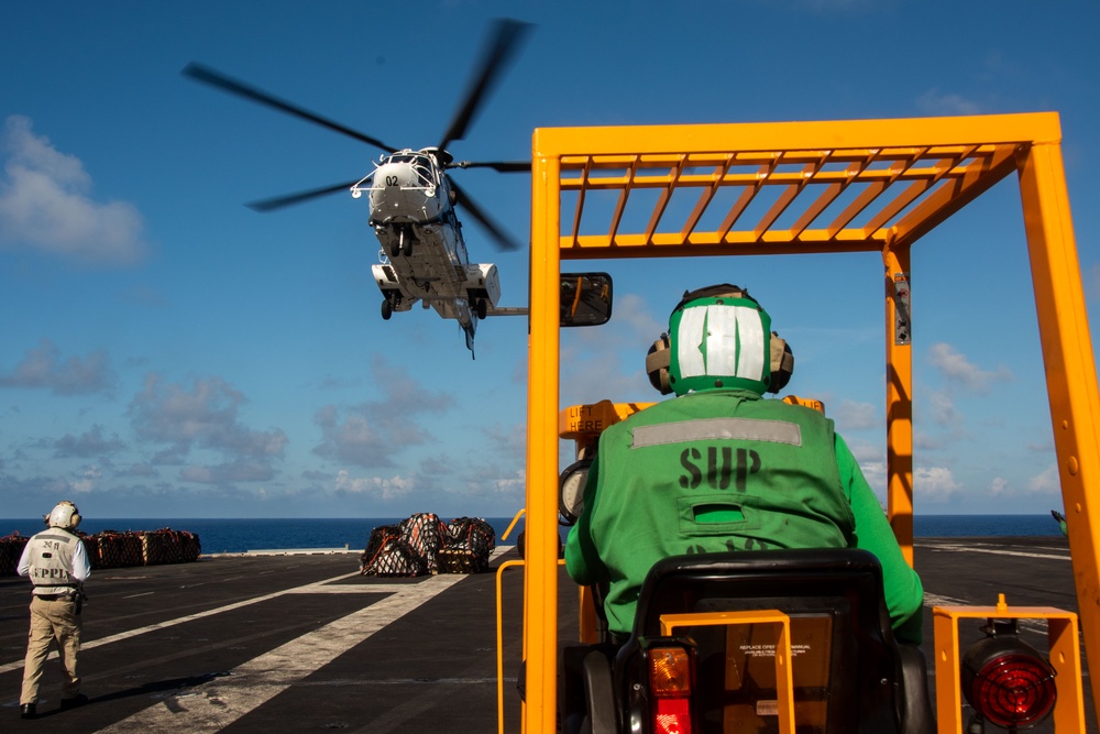 USS Ronald Reagan (CVN 76) conducts replenishment-at-sea with USNS Yukon (T-AO 202) and USNS Carl Brashear (T-AKE 7)