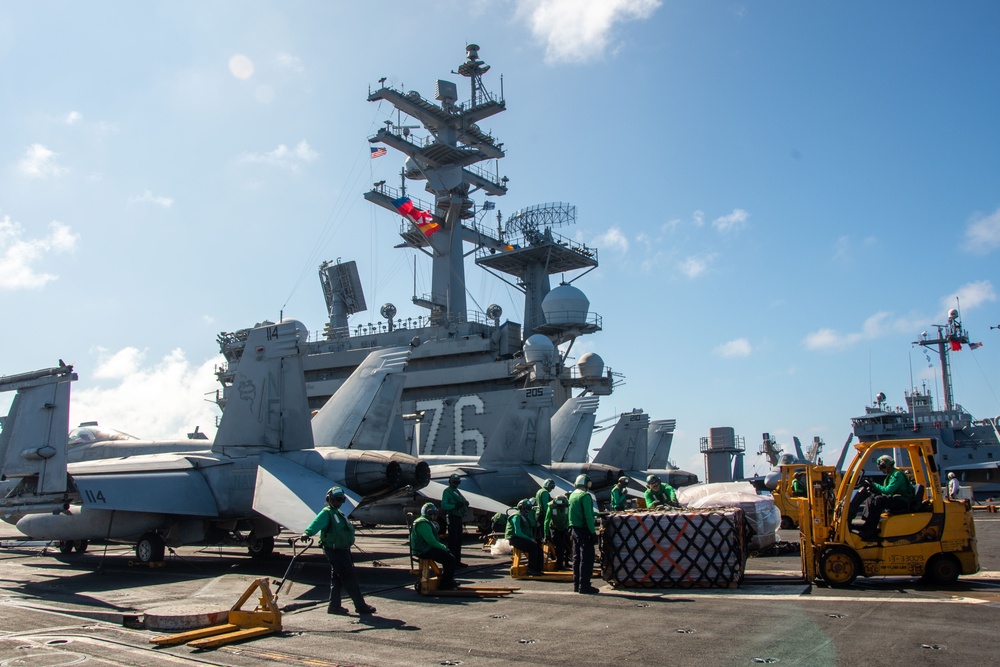 USS Ronald Reagan (CVN 76) conducts replenishment-at-sea with USNS Yukon (T-AO 202) and USNS Carl Brashear (T-AKE 7)