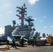 USS Ronald Reagan (CVN 76) conducts replenishment-at-sea with USNS Yukon (T-AO 202) and USNS Carl Brashear (T-AKE 7)