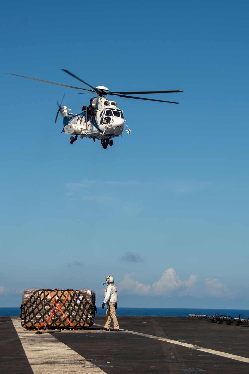 USS Ronald Reagan (CVN 76) conducts replenishment-at-sea with USNS Yukon (T-AO 202) and USNS Carl Brashear (T-AKE 7)