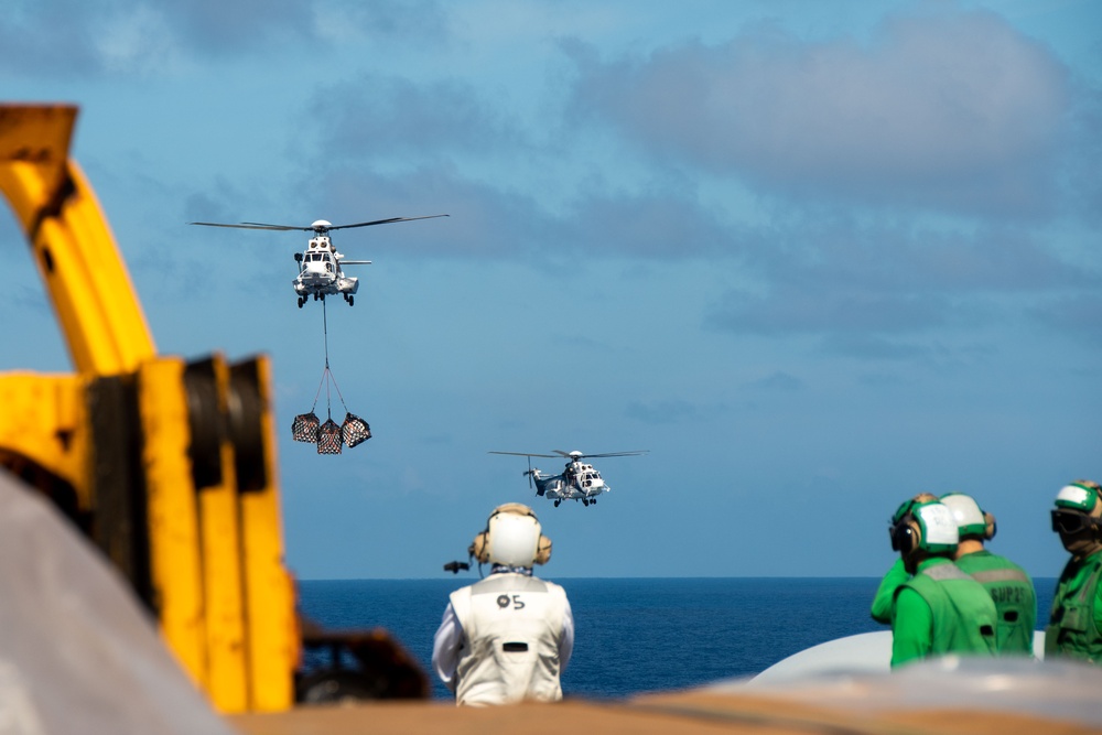 USS Ronald Reagan (CVN 76) conducts replenishment-at-sea with USNS Yukon (T-AO 202) and USNS Carl Brashear (T-AKE 7)