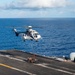 USS Ronald Reagan (CVN 76) conducts replenishment-at-sea with USNS Yukon (T-AO 202) and USNS Carl Brashear (T-AKE 7)