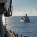 USS Ronald Reagan (CVN 76) conducts replenishment-at-sea with USNS Yukon (T-AO 202) and USNS Carl Brashear (T-AKE 7)