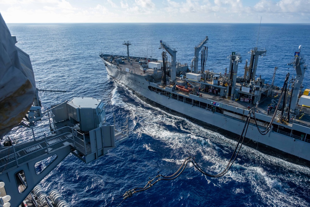 USS Ronald Reagan (CVN 76) conducts replenishment-at-sea with USNS Yukon (T-AO 202) and USNS Carl Brashear (T-AKE 7)