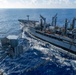 USS Ronald Reagan (CVN 76) conducts replenishment-at-sea with USNS Yukon (T-AO 202) and USNS Carl Brashear (T-AKE 7)