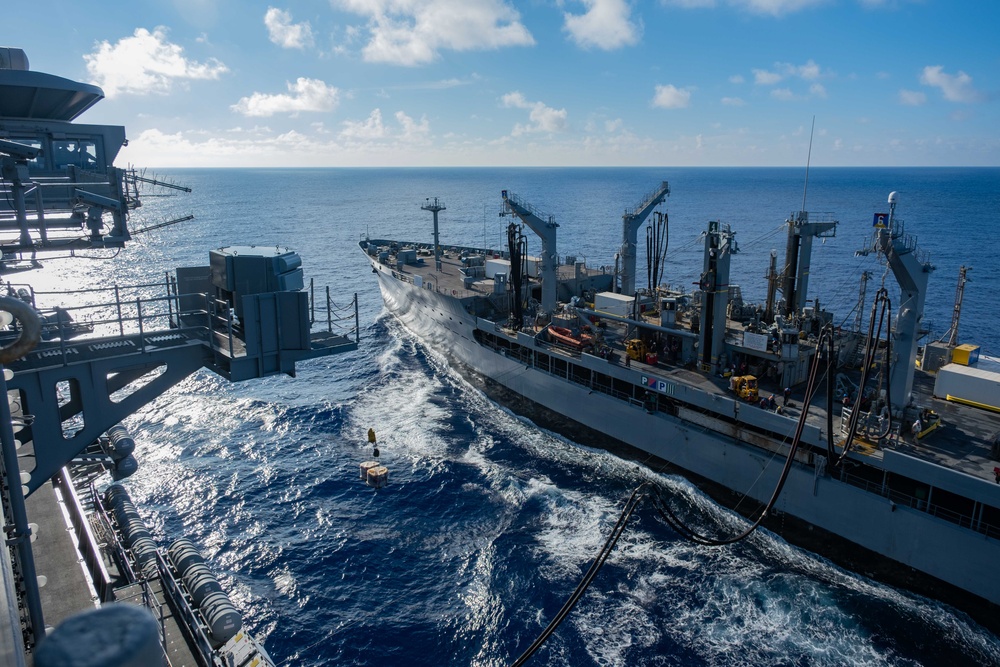 USS Ronald Reagan (CVN 76) conducts replenishment-at-sea with USNS Yukon (T-AO 202) and USNS Carl Brashear (T-AKE 7)