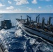 USS Ronald Reagan (CVN 76) conducts replenishment-at-sea with USNS Yukon (T-AO 202) and USNS Carl Brashear (T-AKE 7)