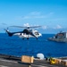 USS Ronald Reagan (CVN 76) conducts replenishment-at-sea with USNS Yukon (T-AO 202) and USNS Carl Brashear (T-AKE 7)