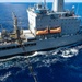 USS Ronald Reagan (CVN 76) conducts replenishment-at-sea with USNS Yukon (T-AO 202) and USNS Carl Brashear (T-AKE 7)