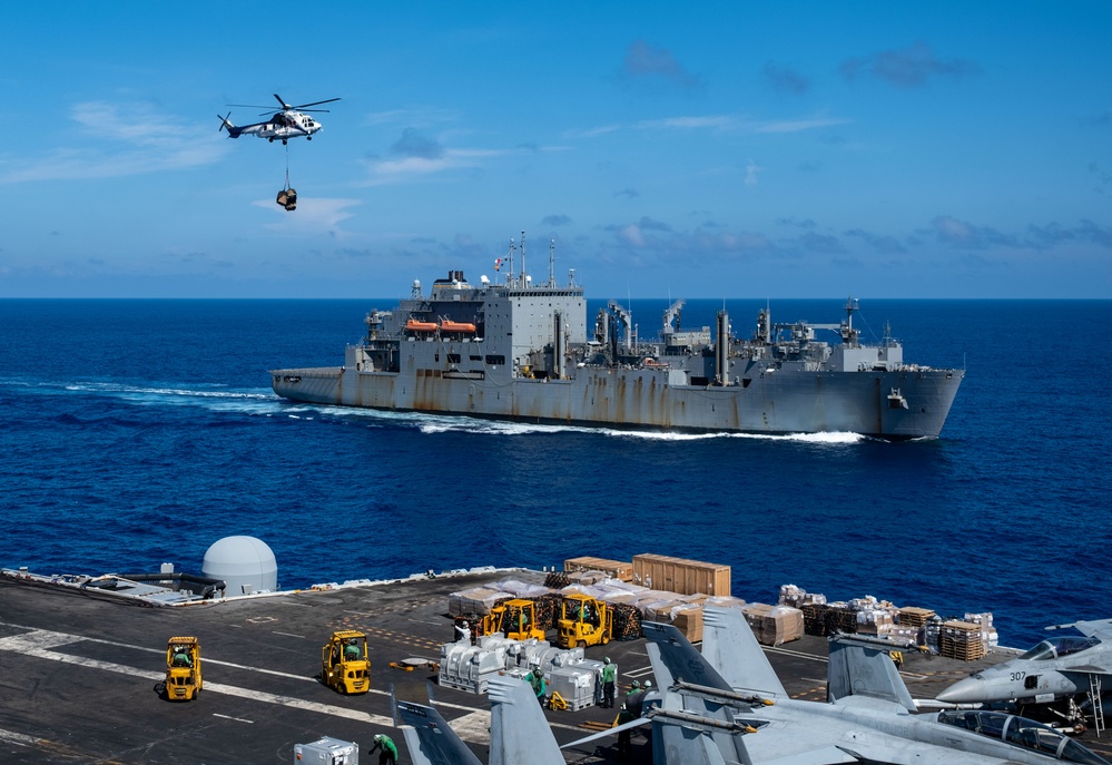 USS Ronald Reagan (CVN 76) conducts replenishment-at-sea with USNS Yukon (T-AO 202) and USNS Carl Brashear (T-AKE 7)