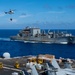 USS Ronald Reagan (CVN 76) conducts replenishment-at-sea with USNS Yukon (T-AO 202) and USNS Carl Brashear (T-AKE 7)