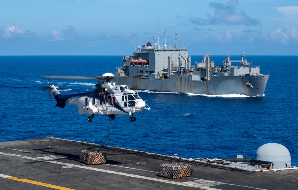 USS Ronald Reagan (CVN 76) conducts replenishment-at-sea with USNS Yukon (T-AO 202) and USNS Carl Brashear (T-AKE 7)