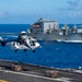 USS Ronald Reagan (CVN 76) conducts replenishment-at-sea with USNS Yukon (T-AO 202) and USNS Carl Brashear (T-AKE 7)