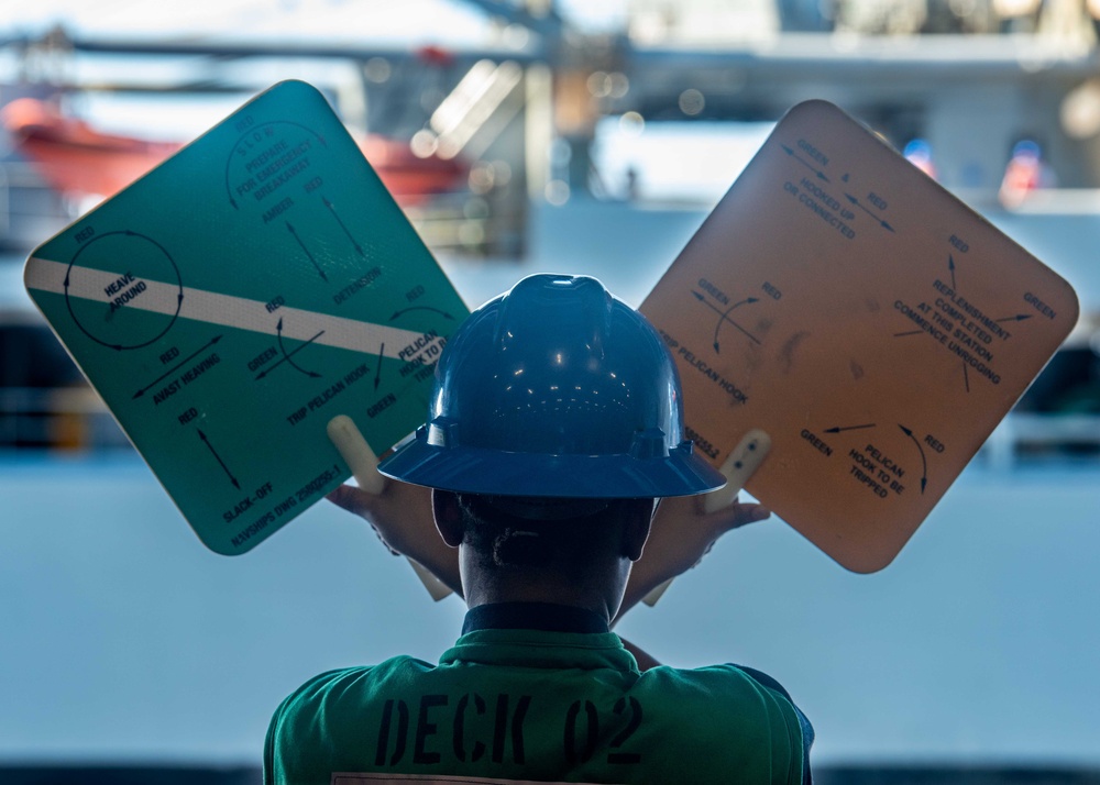 USS Ronald Reagan (CVN 76) conducts replenishment-at-sea with USNS Yukon (T-AO 202) and USNS Carl Brashear (T-AKE 7)