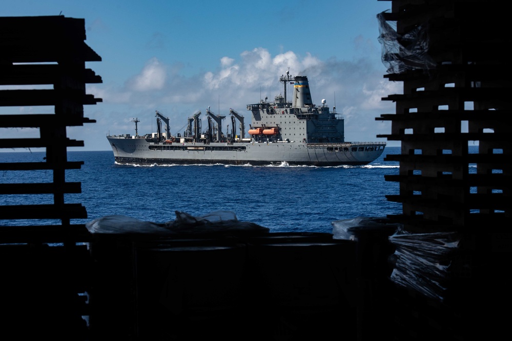 USS Ronald Reagan (CVN 76) conducts replenishment-at-sea with USNS Yukon (T-AO 202) and USNS Carl Brashear (T-AKE 7)